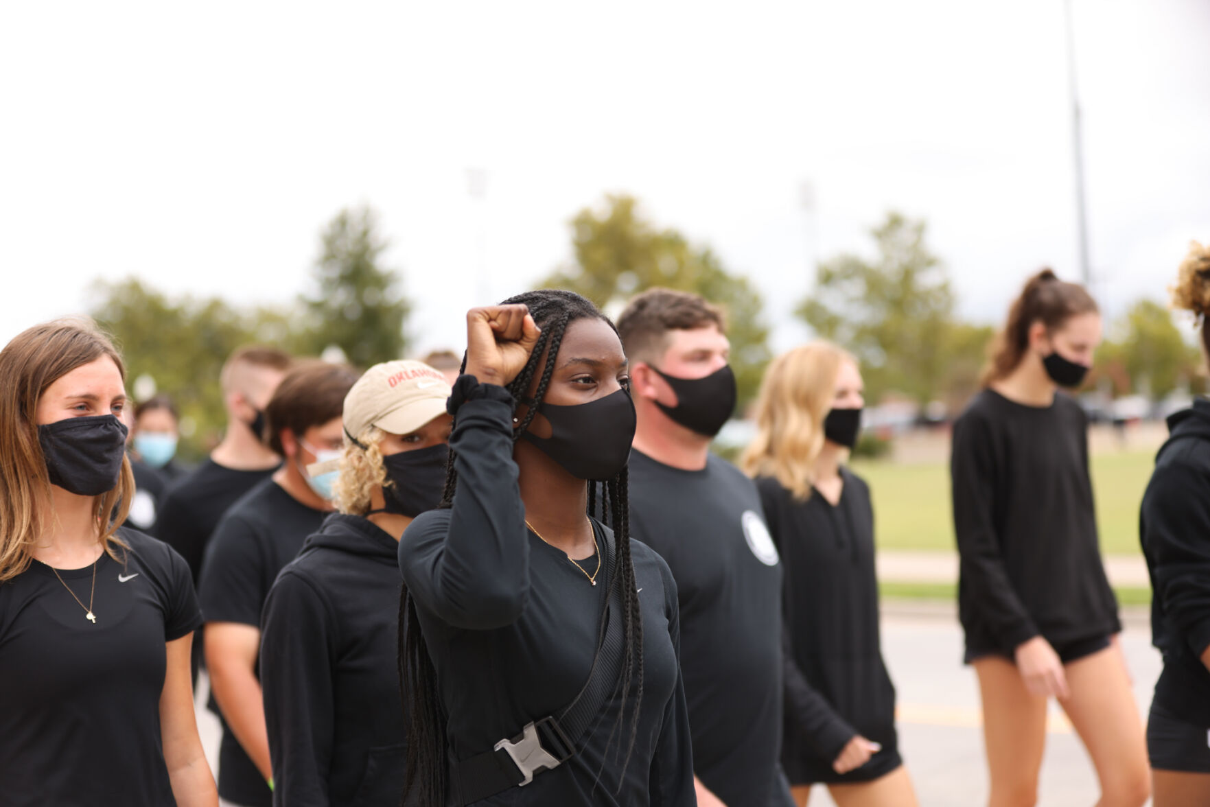 OU Athletes walking down Jenkins
